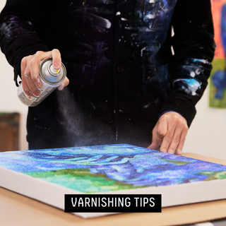 Varnishing tips - artist in studio using liquitex spray varnish to seal their artwork