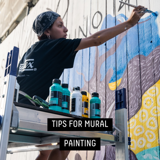 Tips for mural painting - artist painting a mural outside with Liquitex Basics Acrylic Fluid