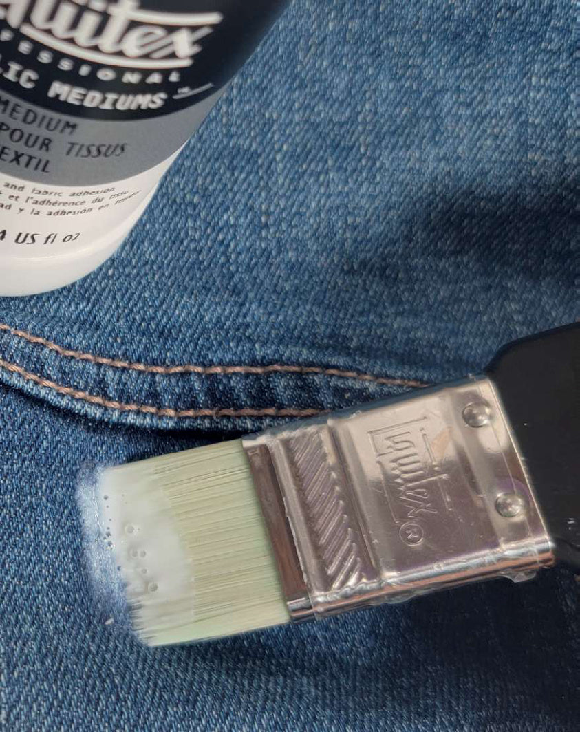 Fabric Medium being applied to denim